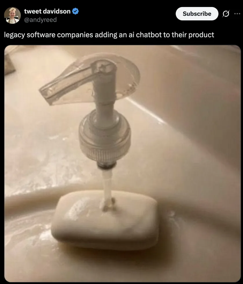Screenshot of a post by @andyreed captioned 'legacy software companies adding an ai chatbot to their product', showing a photo of a pump soap dispenser mounted directly above a bar of soap.